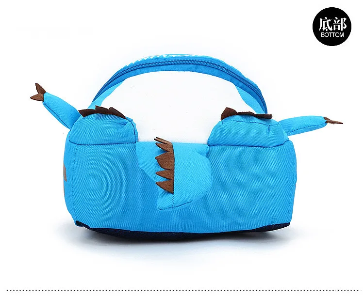 sinine dinosauruse kujuline seljakott, millel on pruunid ogad ja kaks väikest tiiba