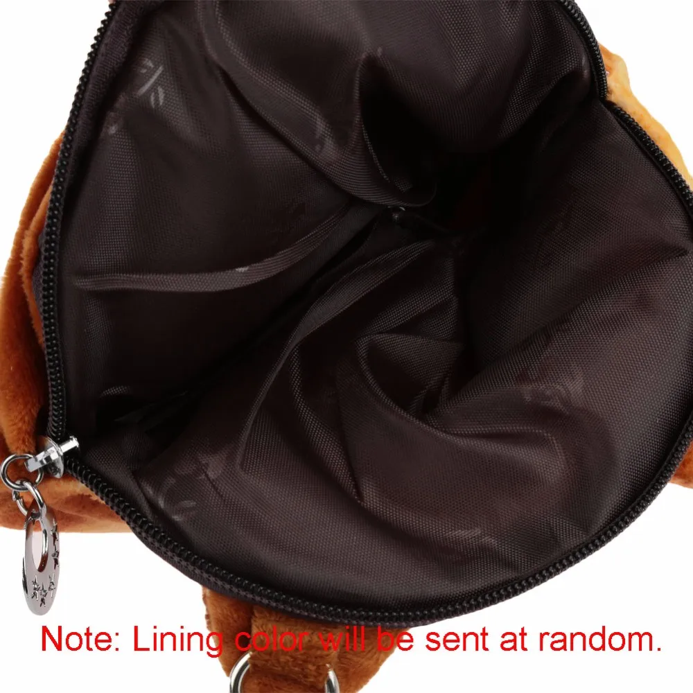 ümara õlakoti avatud sisemus, millel on tume vooder ja hõbedane tõmblukk