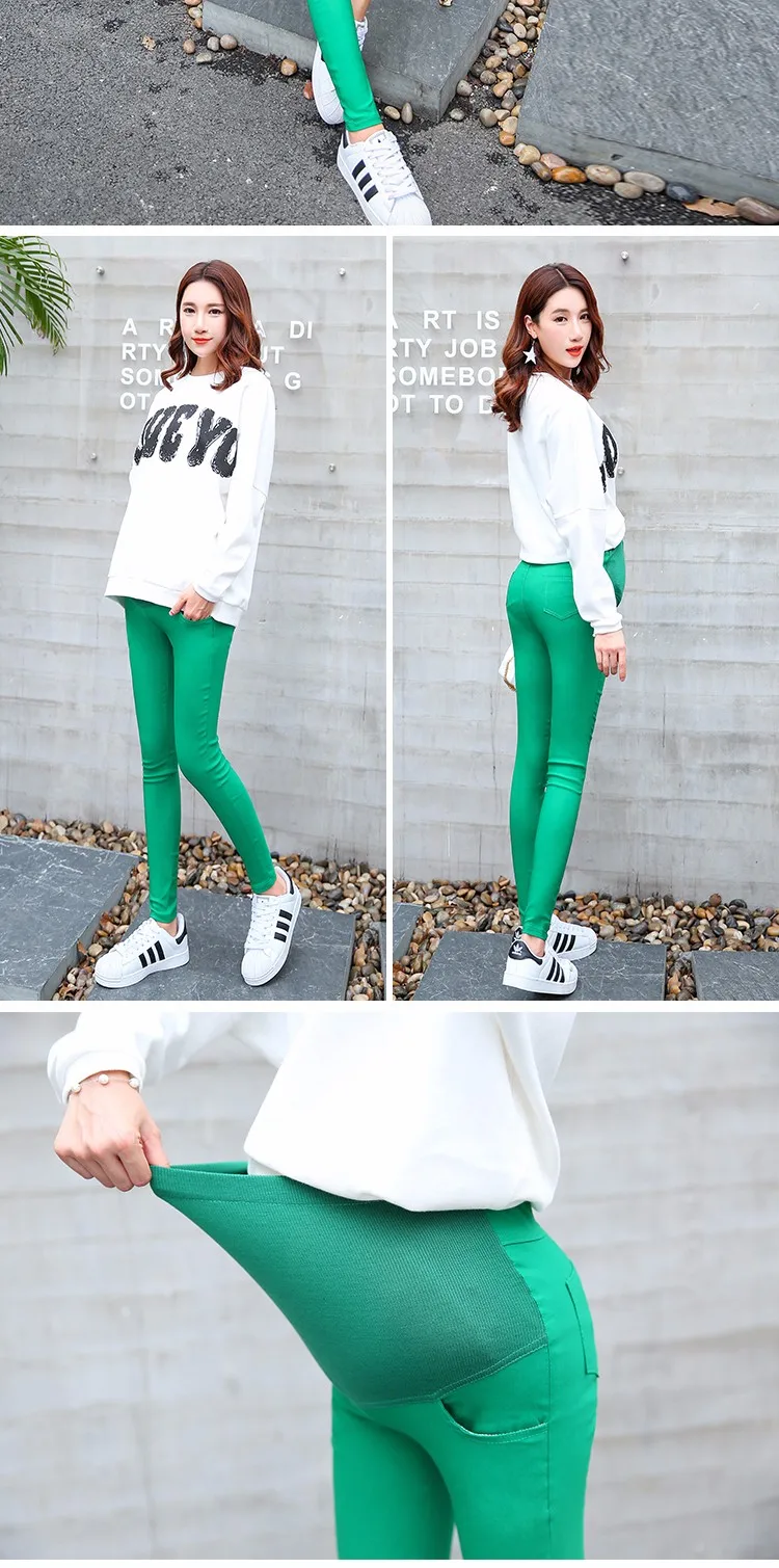 naine kannab rohelisi rasedate pükse ja valget pusa, püksid on venivad ja mugavad