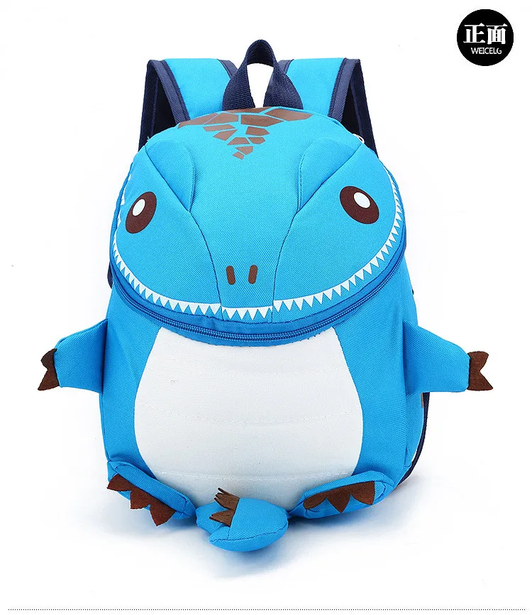 sinine dinosauruse kujuline seljakott, millel on suured silmad ja teravad hambad