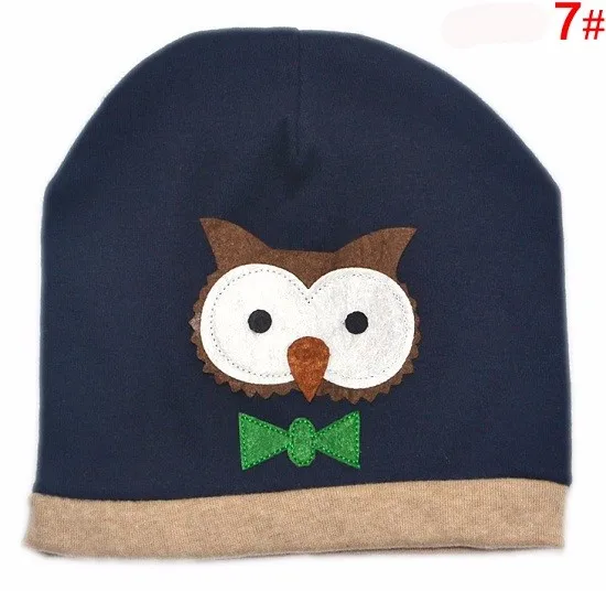 tumesinine laste müts öökulli aplikatsiooniga ja rohelise lipsuga