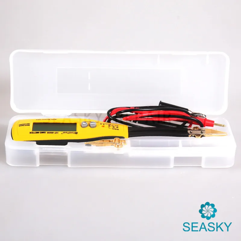 kollane multimeeter plastkarbis koos juhtmetega