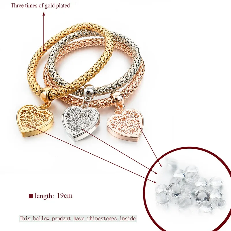 kolm metallist käeketti südamekujuliste ripatsitega