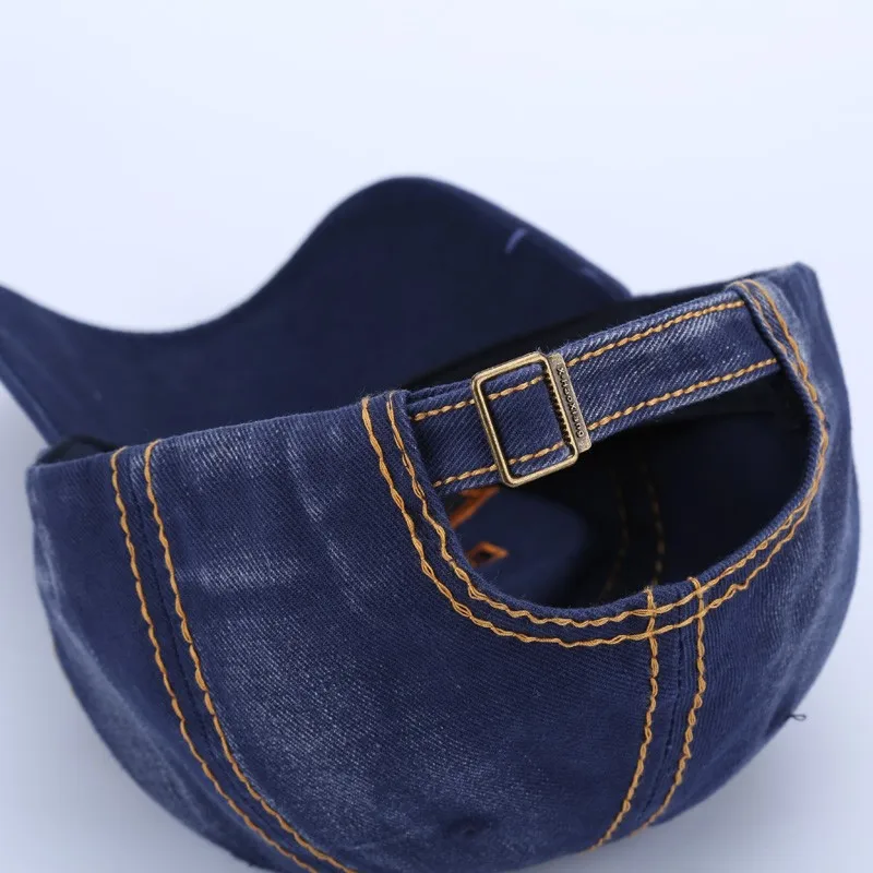 tumesinine puuvillane nokkmüts reguleeritava rihmaga