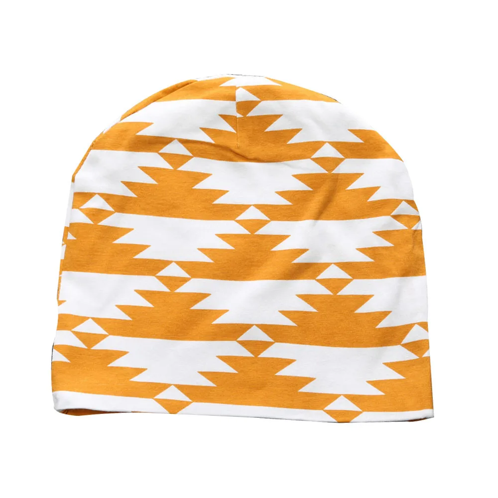 valge ja oranži mustriga beebimüts