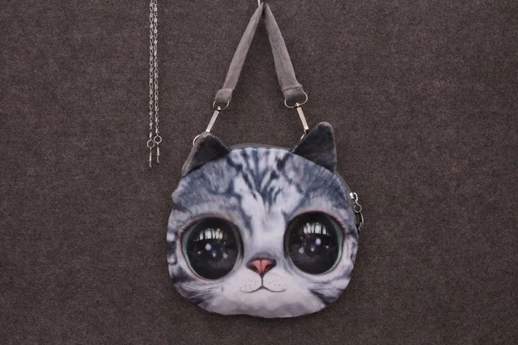 ümar õlakott suure kassi näoga, hallide ja mustade toonidega