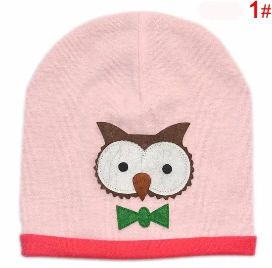 roosa laste müts öökulli aplikatsiooniga ja punase äärega