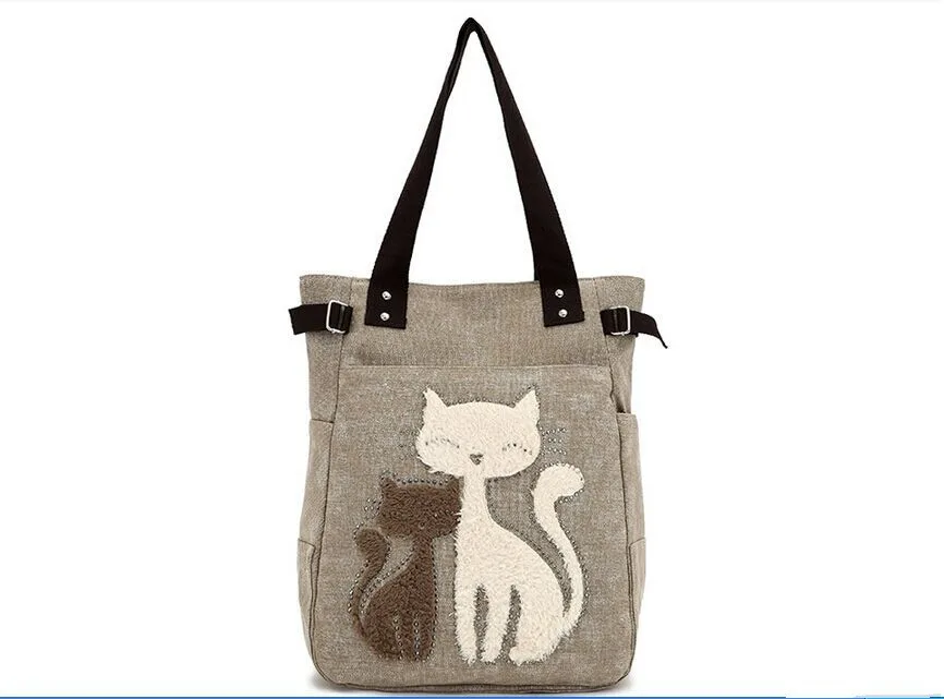 beež õlakott kahe kassikujutisega esiküljel