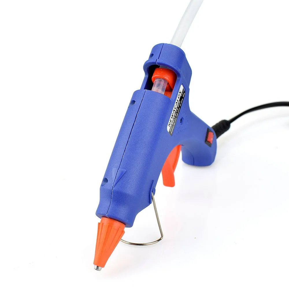 sinine ja oranž liimipüstol koos liimipulgaga