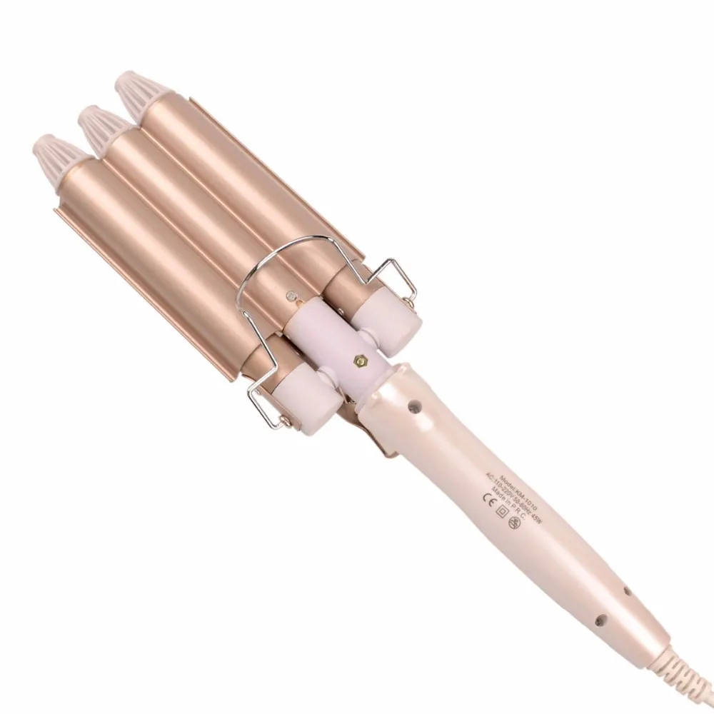 kolme silindriga kuldne lokitang, millel on valge käepide