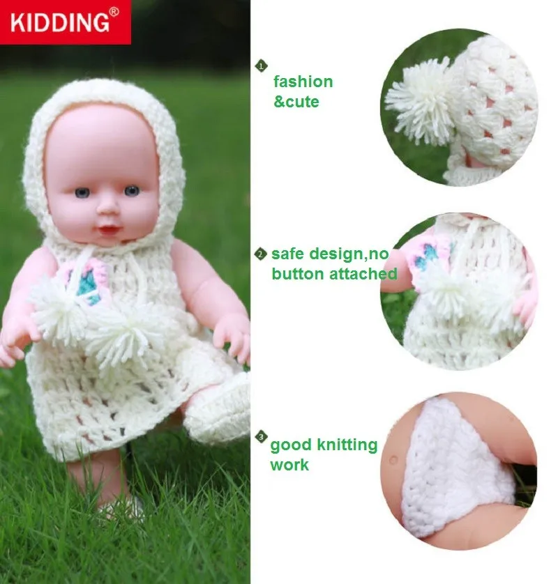 beebinukk valges kootud riietuses rohelisel murul