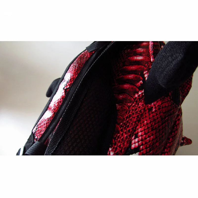 punase ja musta maomustriga laste koolikott