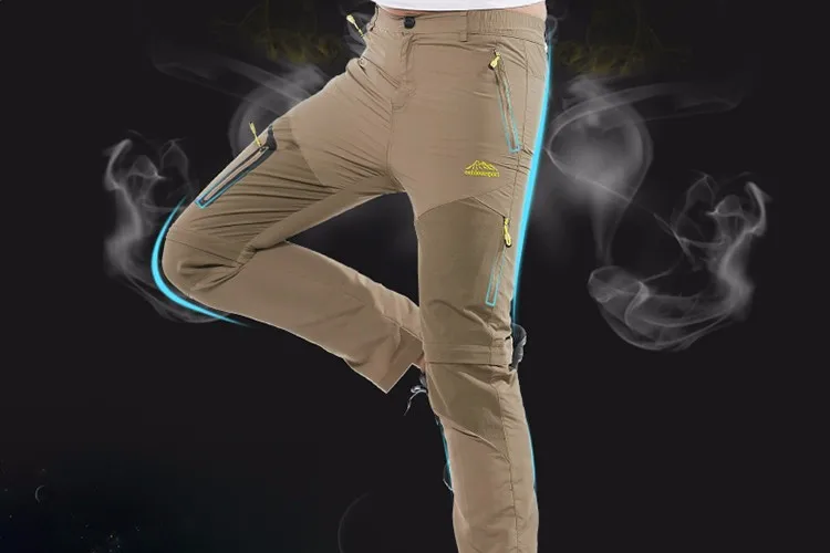 beežid meeste matkapüksid, millel on mitmed lukuga taskud ja elastne materjal