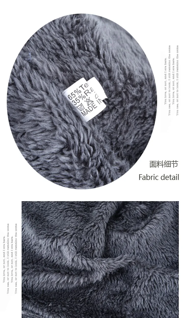 pehme hall karvane kangas, millel on valge silt koos koostise ja hooldusjuhistega