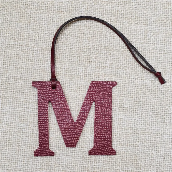 Top Trends: Leather English Letters Charm M Character Bag Pendant Shoppable Styles