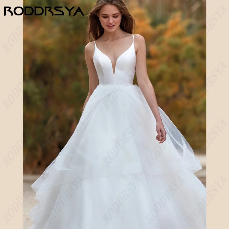 Top Trends: RODDRSYA Spaghetti Straps Wedding Dresses V-Neck Satin A-Line Bridal Gowns Tulle Lace Backless Beach Bride Party Robe De Mariée Shoppable Styles - Image 5