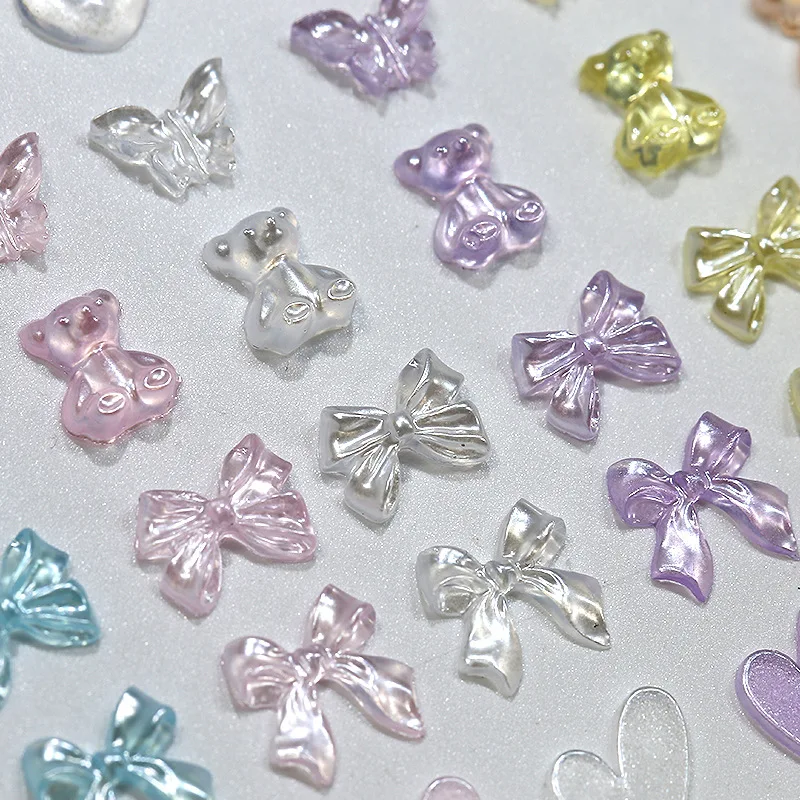 Top Trends: 50PCS 3D Aurora Clear Resin Bow Heart Nail Art Charms Cute Bear Butterfly Glitter Nails Decoration Supplies Jewelry Accessories Shoppable Styles