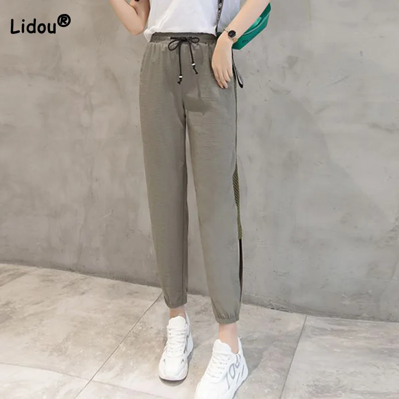 Top Trends: 2023 Summer New Thin Mesh Hollow Out Harem Pants Women Loose Solid Color Drawstring Pockets Leisure Time Cropped Sports Trousers Shoppable Styles