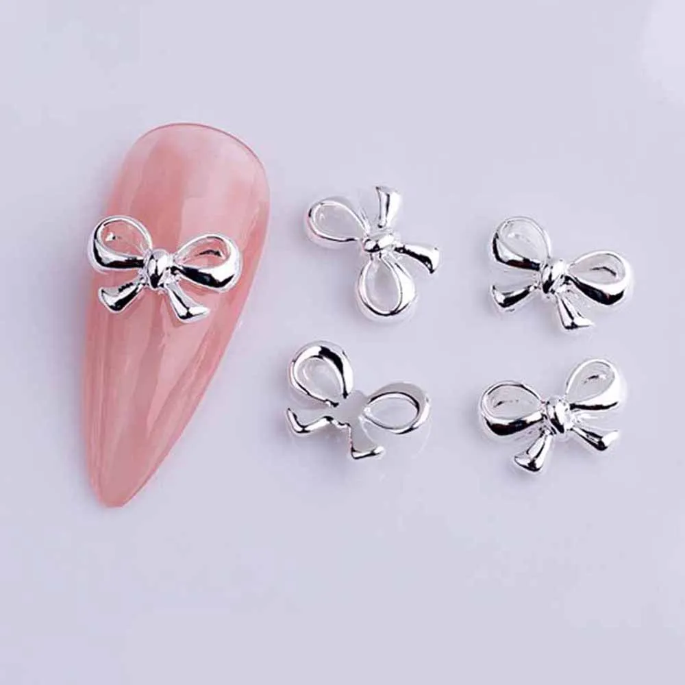 Top Trends: 20pcs Alloy Ribbon Bows Nail Art Charm 3D Gold / Silver Mini Hollow Bowknot Nail Decor Parts DIY Japanese Design Nail Parts Shoppable Styles