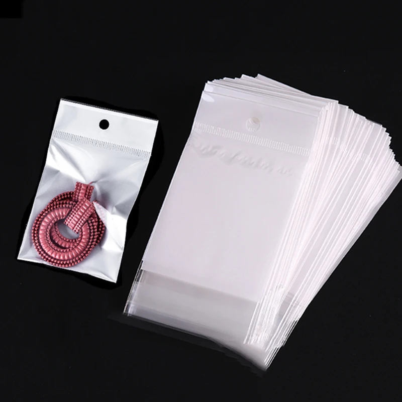 Top Trends: 100pcs Self Sealing Plastic OPP Bags Hanging Self Adhesive White Pouches For Wedding Party Jewelry Packaging Retail Display Bag Shoppable Styles