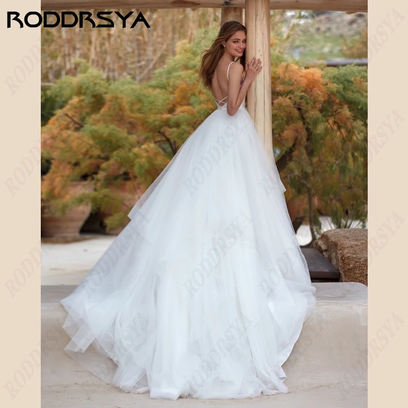 Top Trends: RODDRSYA Spaghetti Straps Wedding Dresses V-Neck Satin A-Line Bridal Gowns Tulle Lace Backless Beach Bride Party Robe De Mariée Shoppable Styles - Image 6