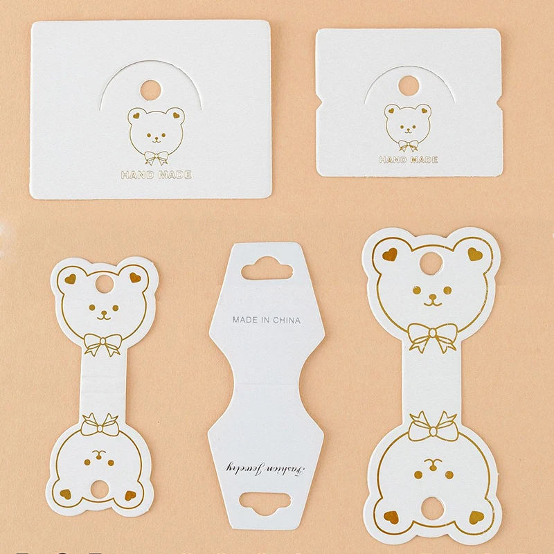 Top Trends: 50pcs Hair Jewelry Display Cards Gold Stamping Bear Pattern Packing Cards For Hair Rope Bracelet Necklace Retail Price Tag Label Shoppable Styles