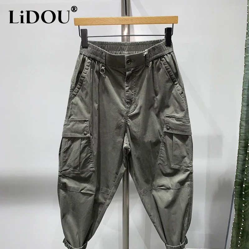 Top Trends: Spring Autumn New Solid Color All-match Haren Pants Man Elastic Waist Zipper Button Pockets Street Personality Pencil Trousers Shoppable Styles