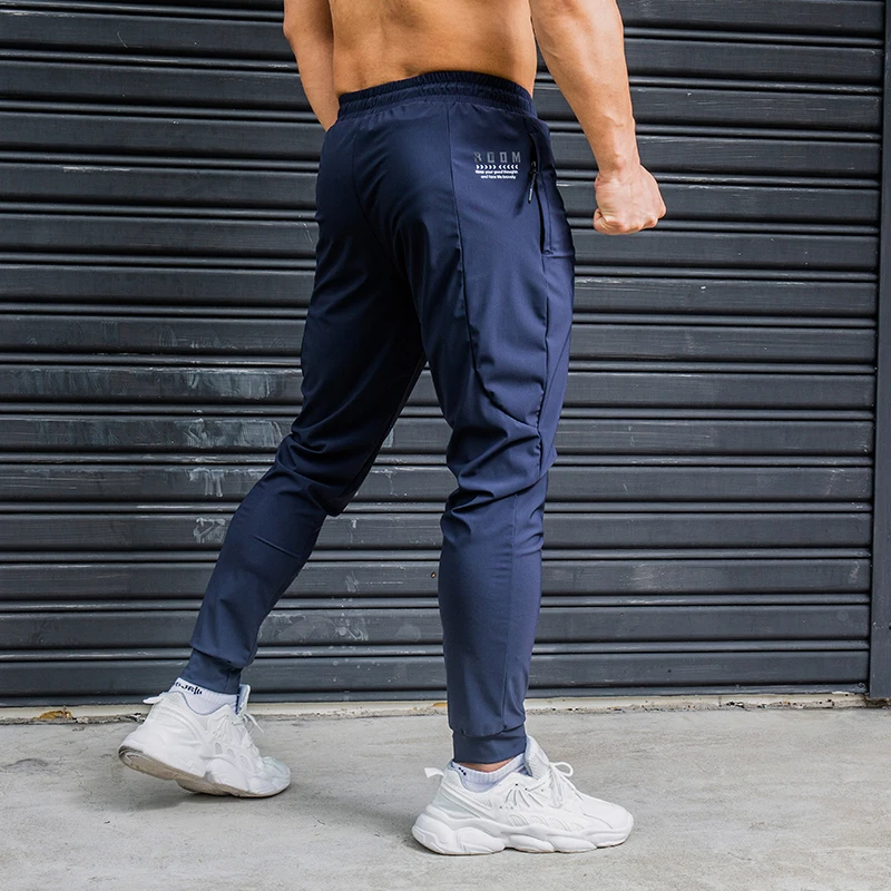 Top Trends: Elasticity Men Running Pants Casual Sweatpants With Zipper Pockets Training Jogging Fitness Trousers Gym Workout Sport Pants Shoppable Styles