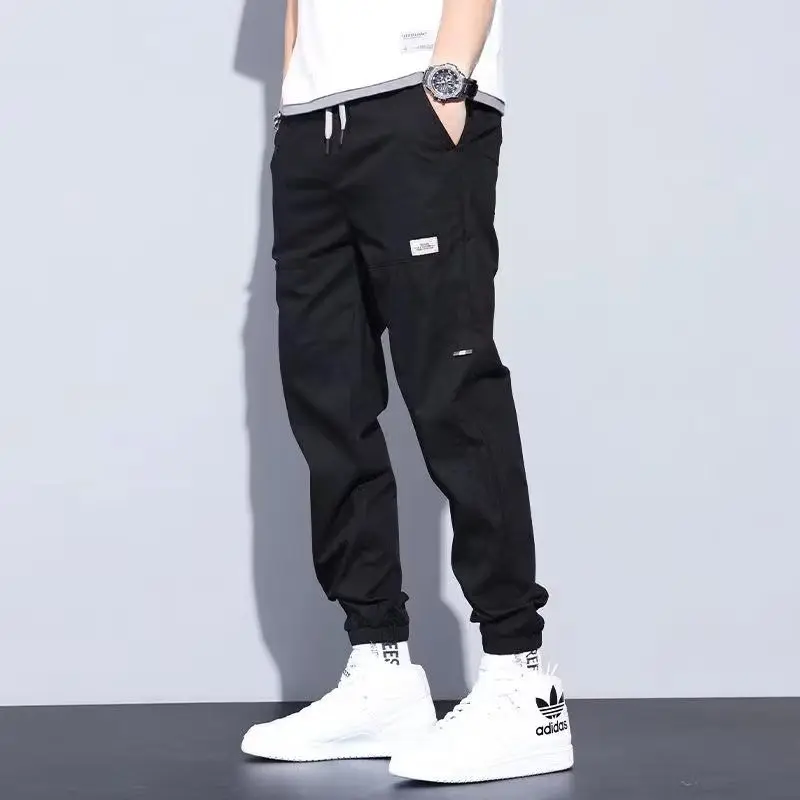 Top Trends: Casual Ventilate Patch Solid Color Men's Cargo Pants Classic Waist Drawstring Street Casual All-match Tie One's Feet Trousers Shoppable Styles - Image 6