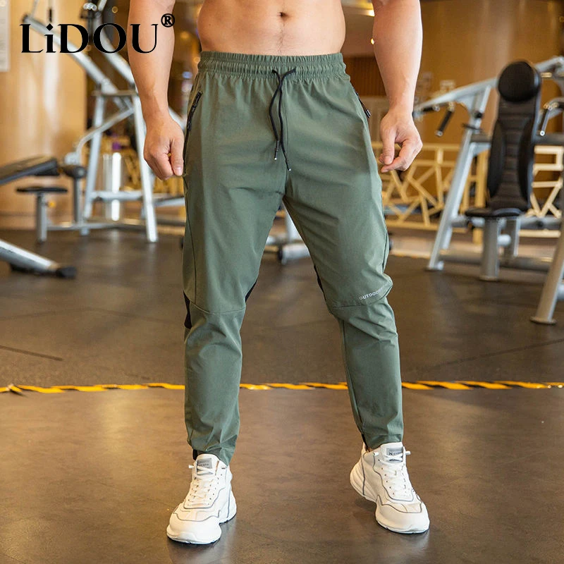 Top Trends: 2023 Summer Thin Style Ice Silk Fabric Motion Trousers Man Solid Color Elastic Waist Quick Drying Loose Bodybuilding Sweatpants Shoppable Styles